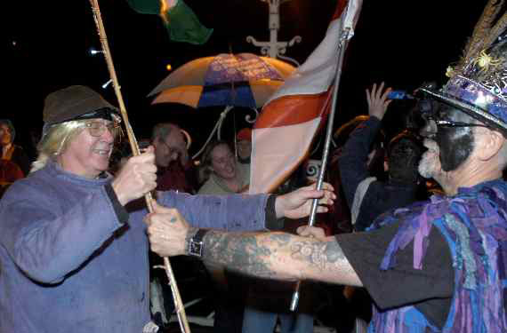 Image of the Chepstow Widders exchanging flags on the old Wye Bridge in Chepstow during the Wassail and Mari Lwyd celebrations